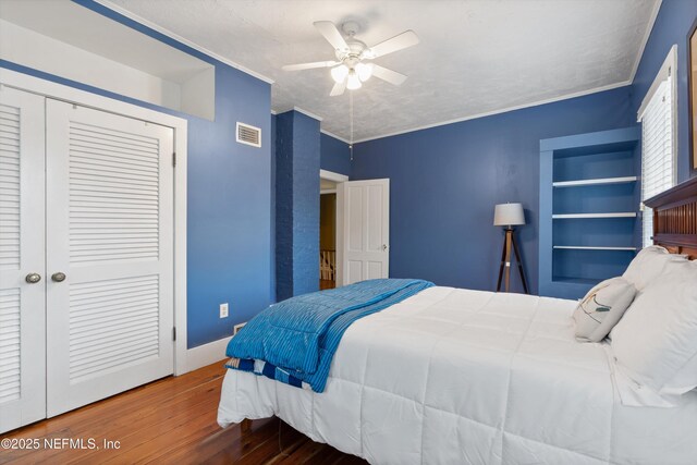 195 S Roscoe Blvd, Ponte Vedra Beach, FL 32082 - bedroom with wood finished floors, a closet, ceiling fan, crown molding, and baseboards