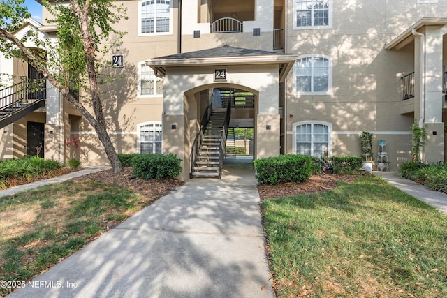 1655 The Greens Way Unit 2432, Jacksonville Beach, FL 32250 - entrance to property with stucco siding