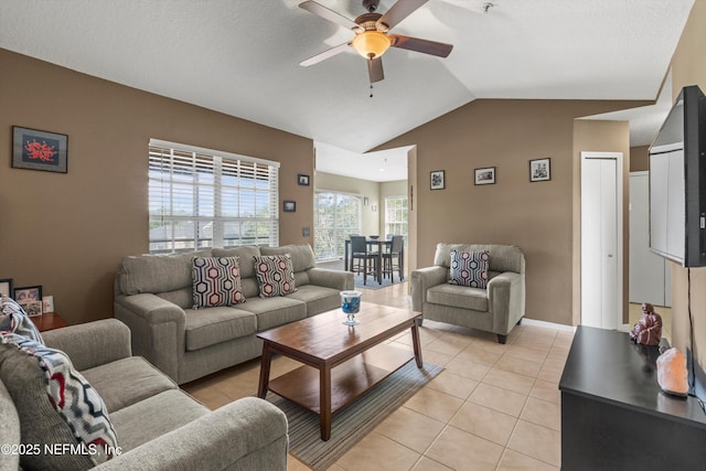 1655 The Greens Way Unit 2432, Jacksonville Beach, FL 32250 - living area featuring ceiling fan, light tile patterned floors, and lofted ceiling