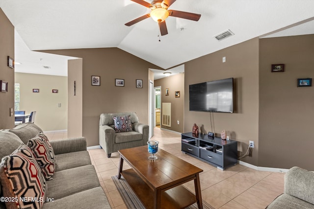 1655 The Greens Way Unit 2432, Jacksonville Beach, FL 32250 - living area with a ceiling fan, light tile patterned floors, lofted ceiling, and baseboards