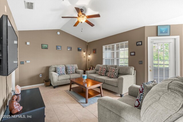1655 The Greens Way Unit 2432, Jacksonville Beach, FL 32250 - living room featuring a ceiling fan, vaulted ceiling, light tile patterned flooring, and baseboards