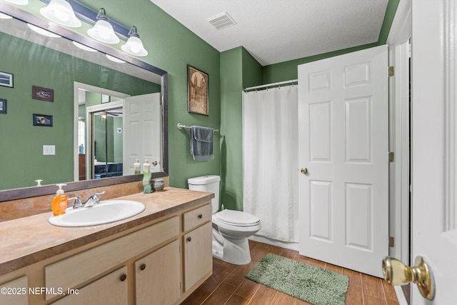 1655 The Greens Way Unit 2432, Jacksonville Beach, FL 32250 - full bathroom featuring toilet, vanity, wood finished floors, and curtained shower