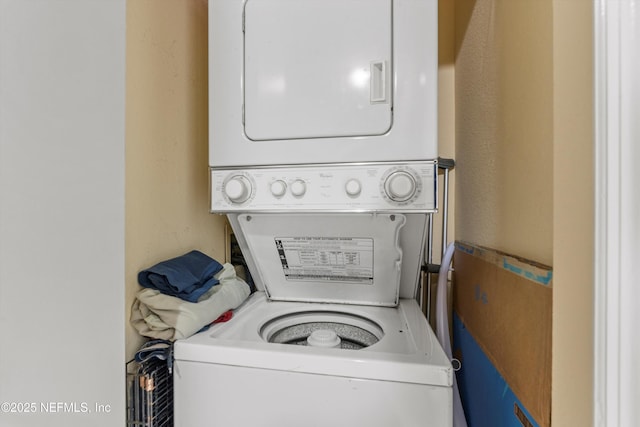 1655 The Greens Way Unit 2432, Jacksonville Beach, FL 32250 - laundry area with stacked washing machine and dryer