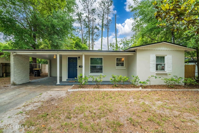 5164 Marlene Ave, Jacksonville, FL 32210 - single story home featuring fence, driveway, a carport, stucco siding, and covered porch