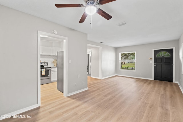 5164 Marlene Ave, Jacksonville, FL 32210 - unfurnished living room featuring light wood-type flooring, a ceiling fan, and baseboards