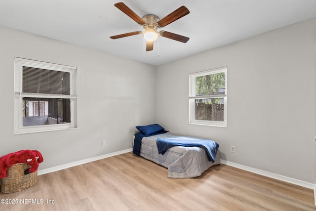 5164 Marlene Ave, Jacksonville, FL 32210 - bedroom with wood finished floors, baseboards, and ceiling fan