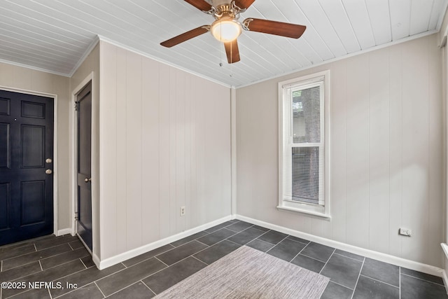 5164 Marlene Ave, Jacksonville, FL 32210 - empty room with ornamental molding, baseboards, ceiling fan, and dark tile patterned floors