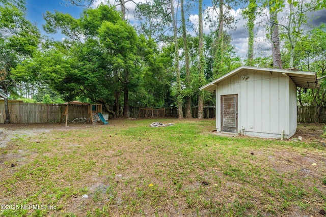 5164 Marlene Ave, Jacksonville, FL 32210 - view of yard featuring a playground, an outbuilding, and a storage unit