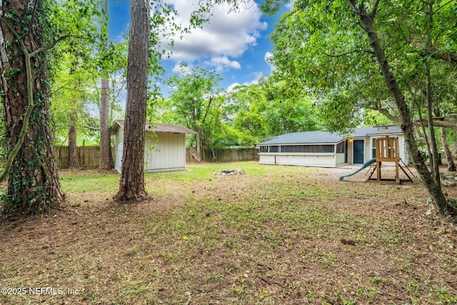 5164 Marlene Ave, Jacksonville, FL 32210 - view of yard with a storage unit and an outbuilding