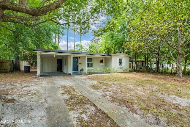 5164 Marlene Ave, Jacksonville, FL 32210 - ranch-style house featuring driveway, fence, and an attached carport