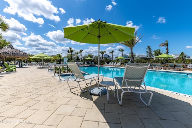 836 Margaritaville Ave, Daytona Beach, FL 32124 - community pool with a patio area