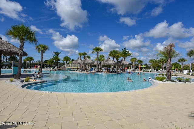 836 Margaritaville Ave, Daytona Beach, FL 32124 - community pool featuring a patio area