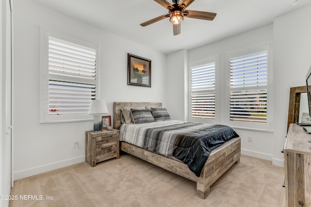 836 Margaritaville Ave, Daytona Beach, FL 32124 - bedroom with baseboards, light carpet, and ceiling fan