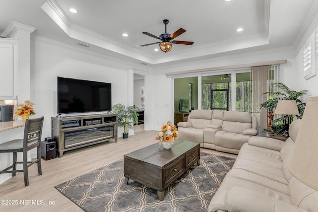 836 Margaritaville Ave, Daytona Beach, FL 32124 - living area with a ceiling fan, a raised ceiling, wood finished floors, crown molding, and recessed lighting