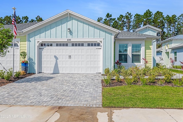 836 Margaritaville Ave, Daytona Beach, FL 32124 - single story home featuring a garage, decorative driveway, board and batten siding, and roof with shingles