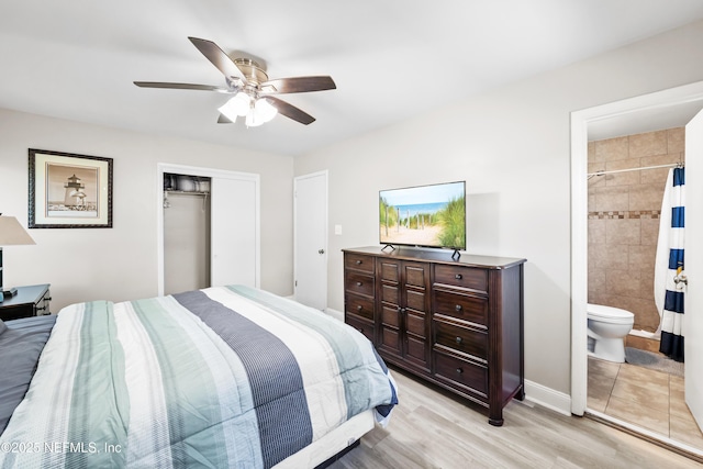 7315 Wonder Ln, Jacksonville, FL 32244 - bedroom featuring a closet, light wood finished floors, a ceiling fan, baseboards, and ensuite bath
