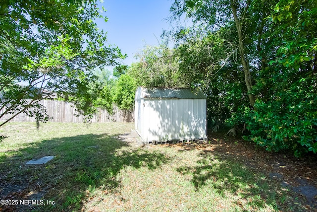 7315 Wonder Ln, Jacksonville, FL 32244 - view of yard featuring a storage unit and an outdoor structure