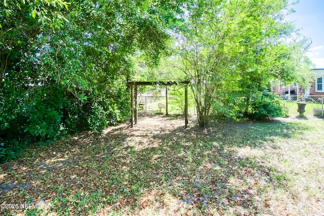 7315 Wonder Ln, Jacksonville, FL 32244 - view of yard featuring fence and a carport