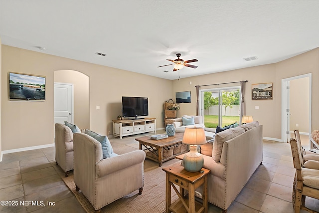 213 Haas Ave, Saint Augustine, FL 32095 - living area with arched walkways, ceiling fan, tile patterned floors, and baseboards