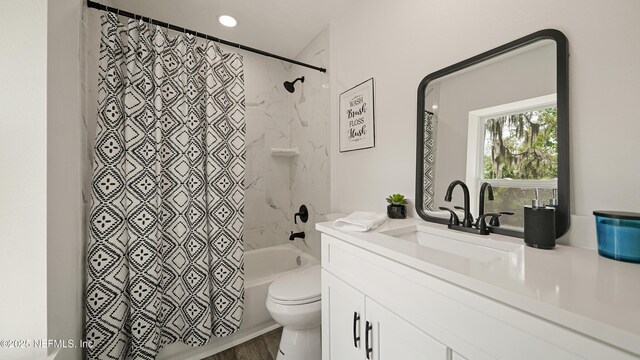 bathroom with toilet, shower / bathtub combination with curtain, vanity, and wood finished floors