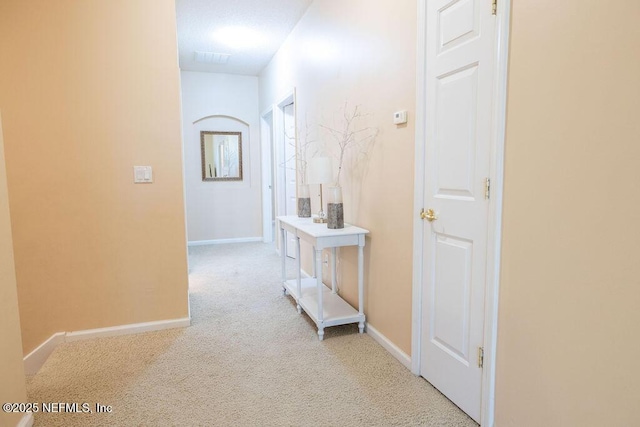 2543 Willow Creek Dr, Fleming Island, FL 32003 - hallway featuring light carpet and baseboards