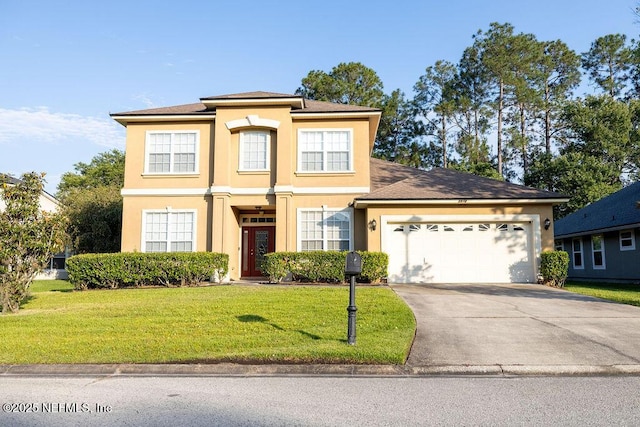 2543 Willow Creek Dr, Fleming Island, FL 32003 - traditional home with stucco siding, driveway, an attached garage, and a front yard