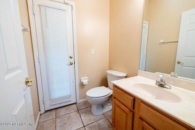 2543 Willow Creek Dr, Fleming Island, FL 32003 - bathroom with toilet, vanity, tile patterned floors, and baseboards