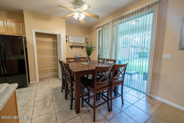 2543 Willow Creek Dr, Fleming Island, FL 32003 - dining room featuring a ceiling fan, baseboards, and light tile patterned flooring