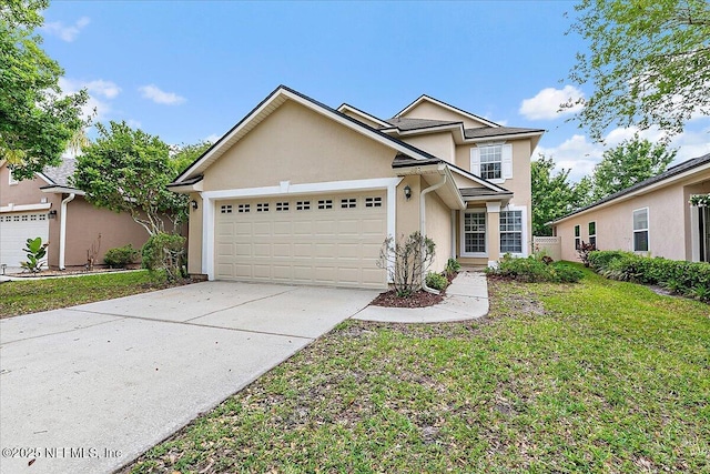 traditional-style home with stucco siding, a garage, driveway, and a front yard