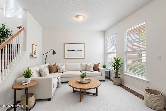 living area with wood finished floors and baseboards