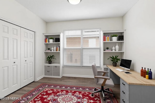office area featuring dark wood-type flooring and baseboards