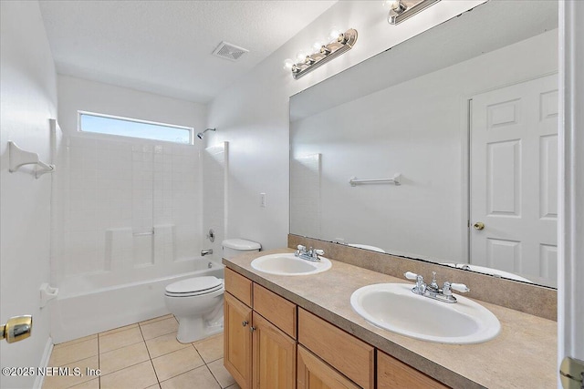 full bath with toilet, tile patterned flooring, double vanity, and bathtub / shower combination