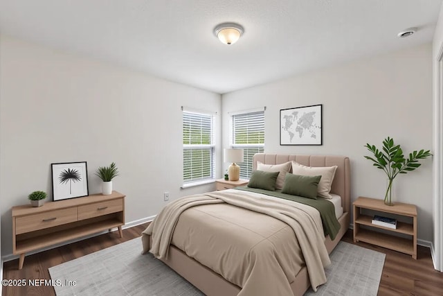 bedroom with wood finished floors