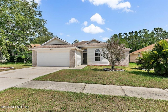 view of front of house featuring a garage, concrete driveway, a front yard, and brick siding