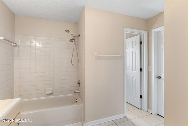 bathroom with tile patterned floors, baseboards, tub / shower combination, and vanity