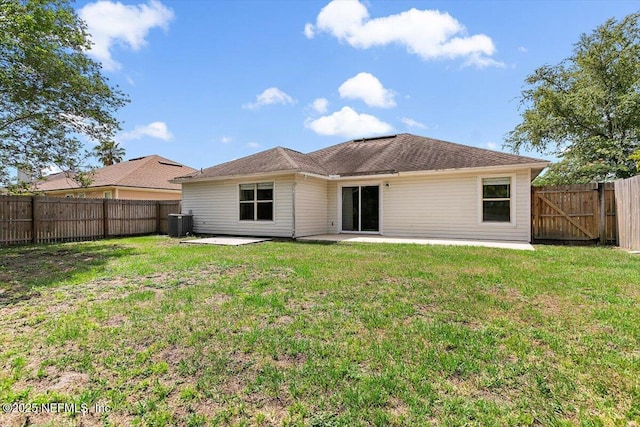 rear view of house featuring a patio and central AC unit