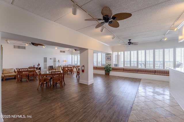3350 S Fletcher Ave Unit D5, Fernandina Beach, FL 32034 - dining area with track lighting, a textured ceiling, ceiling fan, baseboards, and light wood-style floors