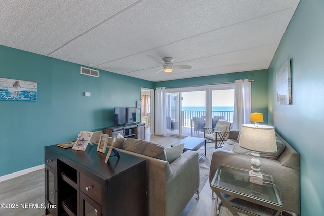 3350 S Fletcher Ave Unit D5, Fernandina Beach, FL 32034 - living area featuring wood finished floors, ceiling fan, a textured ceiling, and baseboards