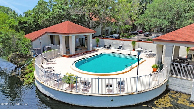 1303 Wood Hill Pl Unit 1303, Jacksonville, FL 32256 - community pool featuring a water view, a patio, and a gazebo