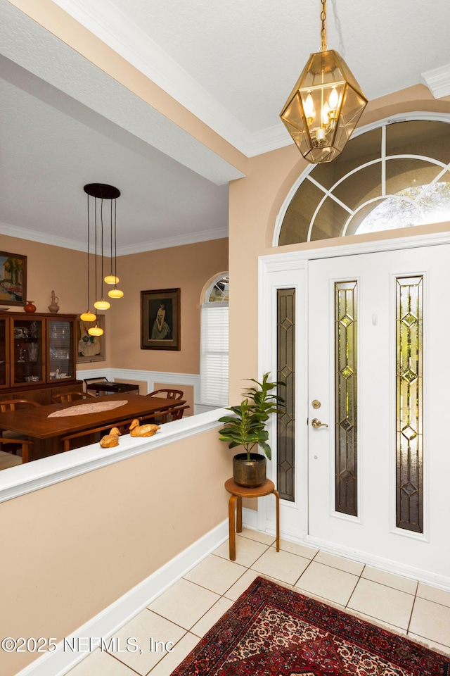 445 W Mill Chase Ct, Ponte Vedra Beach, FL 32082 - foyer featuring a chandelier, light tile patterned floors, and crown molding
