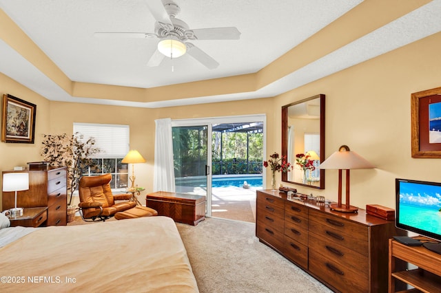 445 W Mill Chase Ct, Ponte Vedra Beach, FL 32082 - bedroom with access to exterior, light colored carpet, a tray ceiling, and a ceiling fan