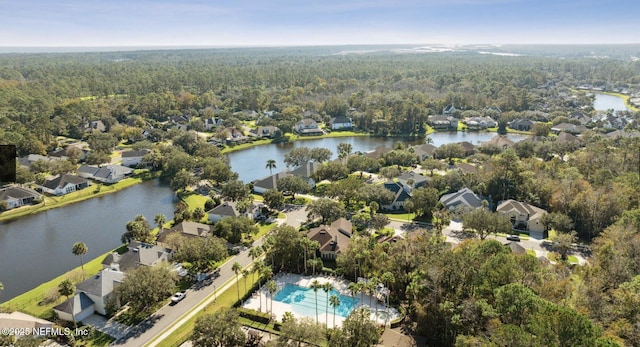 445 W Mill Chase Ct, Ponte Vedra Beach, FL 32082 - aerial view of property's location with a forest, nearby suburban area, a large body of water, and a pool