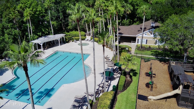 445 W Mill Chase Ct, Ponte Vedra Beach, FL 32082 - community pool with a patio area and view of scattered trees