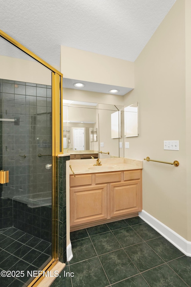 445 W Mill Chase Ct, Ponte Vedra Beach, FL 32082 - bathroom featuring a stall shower, baseboards, vanity, tile patterned floors, and a textured ceiling