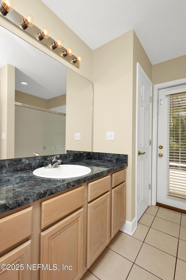 445 W Mill Chase Ct, Ponte Vedra Beach, FL 32082 - full bathroom featuring vanity, tile patterned floors, and baseboards