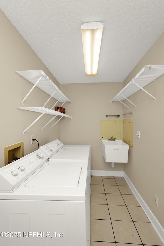 445 W Mill Chase Ct, Ponte Vedra Beach, FL 32082 - washroom featuring separate washer and dryer, light tile patterned floors, and baseboards