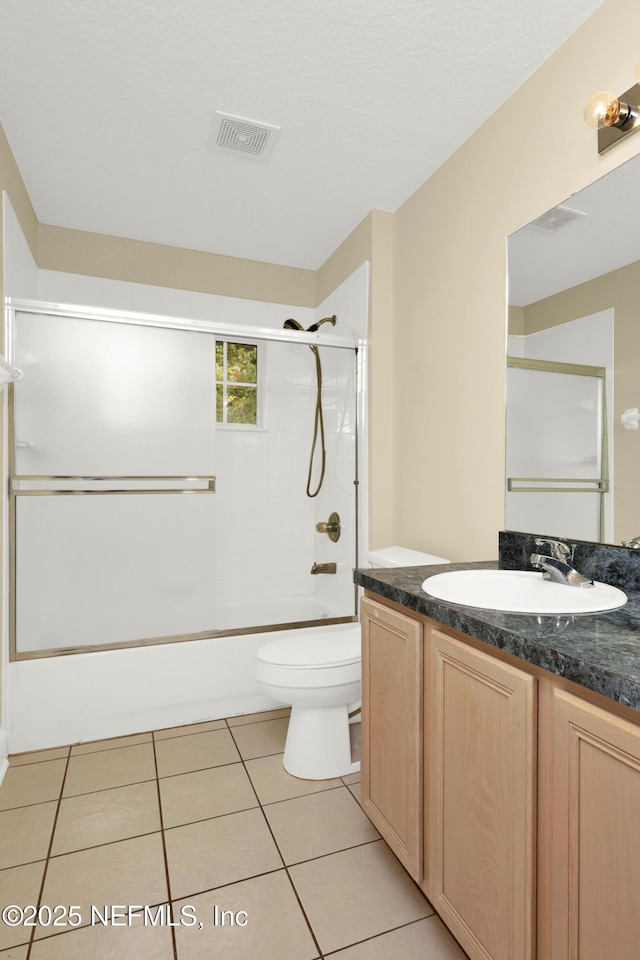 445 W Mill Chase Ct, Ponte Vedra Beach, FL 32082 - full bathroom with vanity, tile patterned flooring, shower / bath combination with glass door, and toilet