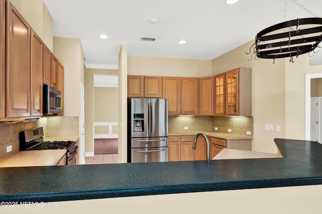 445 W Mill Chase Ct, Ponte Vedra Beach, FL 32082 - kitchen featuring appliances with stainless steel finishes, tasteful backsplash, glass insert cabinets, recessed lighting, and tile patterned flooring