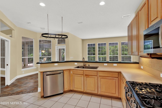 445 W Mill Chase Ct, Ponte Vedra Beach, FL 32082 - kitchen featuring appliances with stainless steel finishes, a sink, a peninsula, tasteful backsplash, and recessed lighting