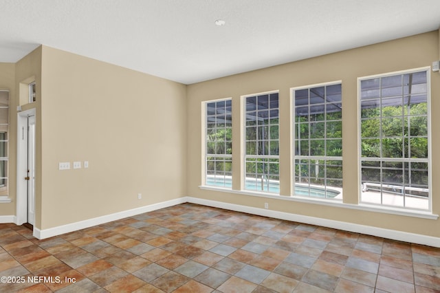445 W Mill Chase Ct, Ponte Vedra Beach, FL 32082 - unfurnished room featuring baseboards and stone finish floors